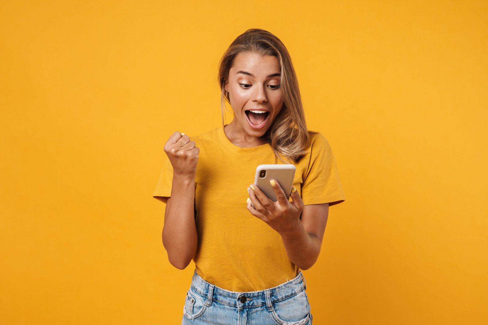 Portrait of a Happy Cheerful Woman Celebrating Success